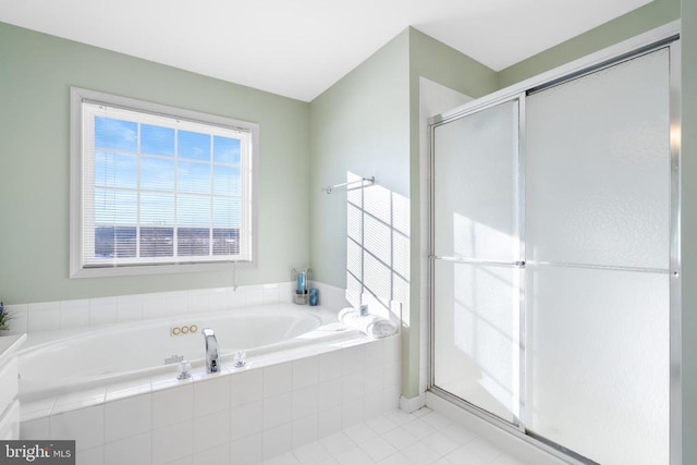 full bath with a stall shower, tile patterned flooring, and a garden tub