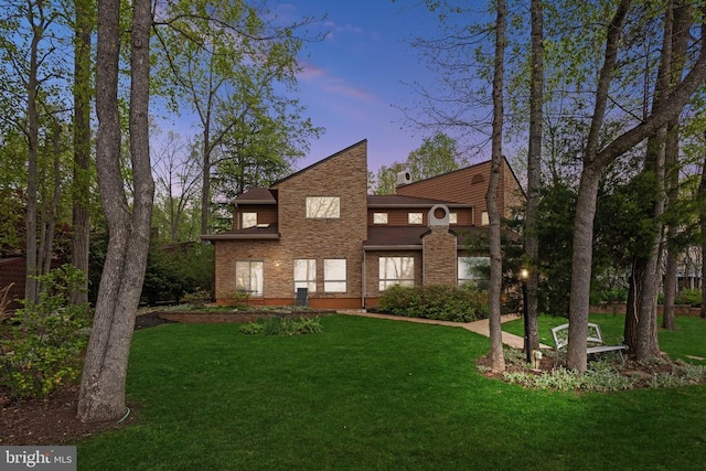 208 Mt Pleasant Dr, Locust Grove, VA 22508 - back of house at dusk featuring a lawn