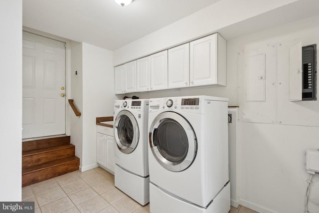 208 Mt Pleasant Dr, Locust Grove, VA 22508 - clothes washing area with washing machine and clothes dryer, light tile patterned flooring, baseboards, and cabinet space