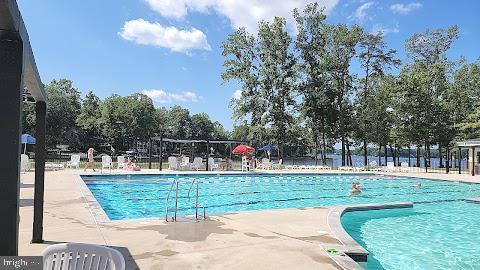 208 Mt Pleasant Dr, Locust Grove, VA 22508 - community pool featuring a patio area
