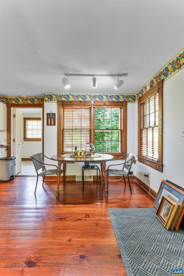 5722 James River Rd, Gladstone, VA 24553 - dining room featuring breakfast area, wood finished floors, and track lighting