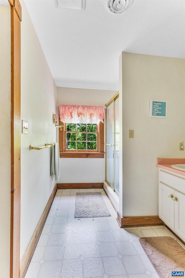 5722 James River Rd, Gladstone, VA 24553 - full bath with baseboards, tile patterned floors, a stall shower, and vanity