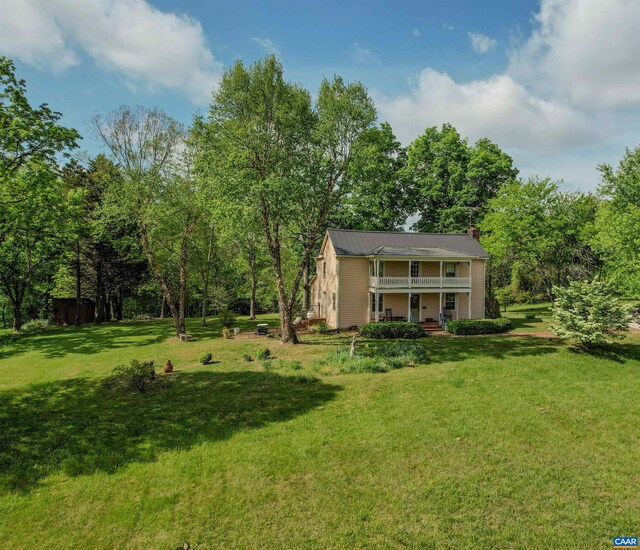 5722 James River Rd, Gladstone, VA 24553 - view of green lawn with a porch and a balcony