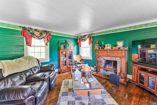 5722 James River Rd, Gladstone, VA 24553 - living area with healthy amount of natural light, a brick fireplace, wood finished floors, crown molding, and baseboards