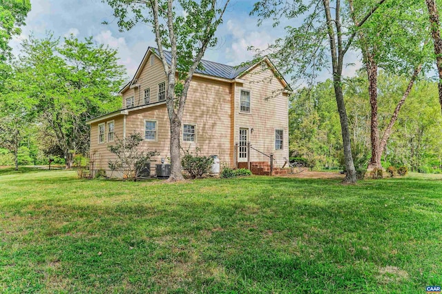 5722 James River Rd, Gladstone, VA 24553 - back of house featuring a yard, central AC, and metal roof