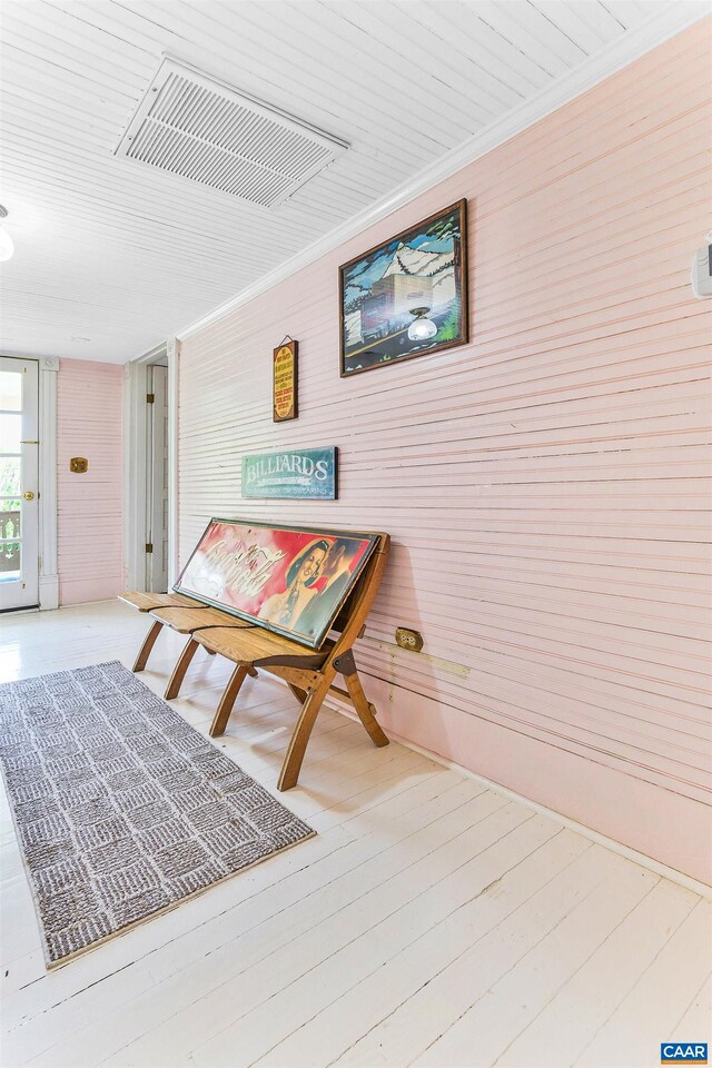 5722 James River Rd, Gladstone, VA 24553 - dining space with wood walls, crown molding, and wood finished floors