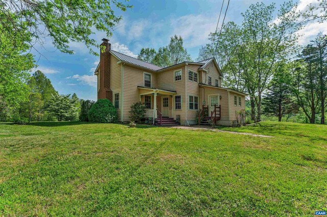 5722 James River Rd, Gladstone, VA 24553 - back of property featuring a chimney, a standing seam roof, metal roof, and a yard