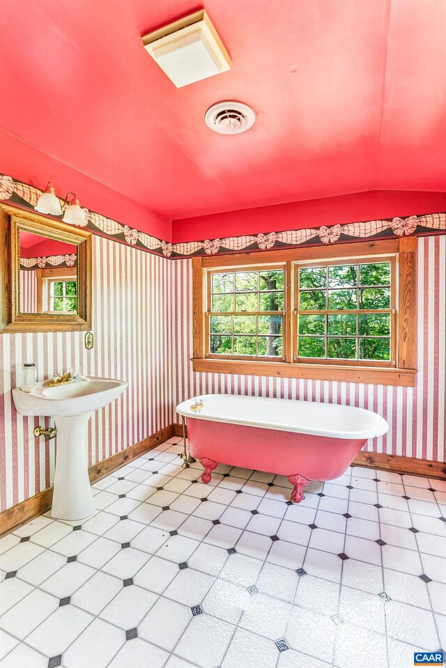 5722 James River Rd, Gladstone, VA 24553 - full bath with tile patterned floors, baseboards, a freestanding bath, and wallpapered walls