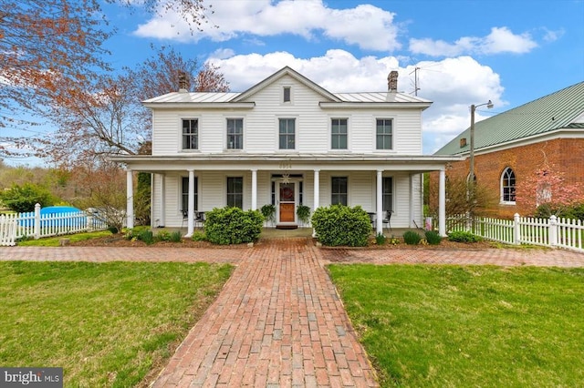 8954 Courthouse Rd, Spotsylvania, VA 22553 - view of front of property with a chimney, a standing seam roof, a porch, and metal roof