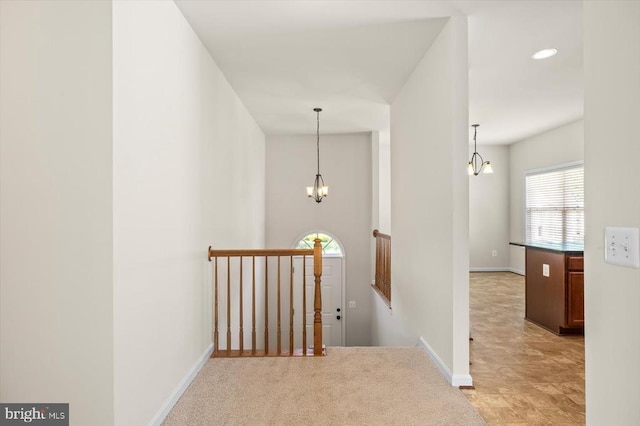 35367 Pheasant Ridge Rd, Locust Grove, VA 22508 - hallway featuring an upstairs landing and a chandelier