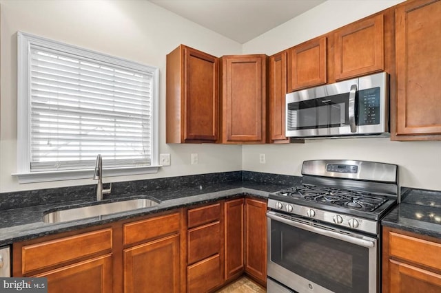 35367 Pheasant Ridge Rd, Locust Grove, VA 22508 - kitchen featuring stainless steel appliances, dark stone countertops, and brown cabinets