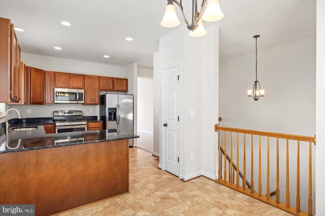 35367 Pheasant Ridge Rd, Locust Grove, VA 22508 - kitchen featuring appliances with stainless steel finishes, a chandelier, brown cabinetry, a peninsula, and dark stone countertops