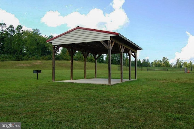 surrounding community featuring a gazebo and a lawn