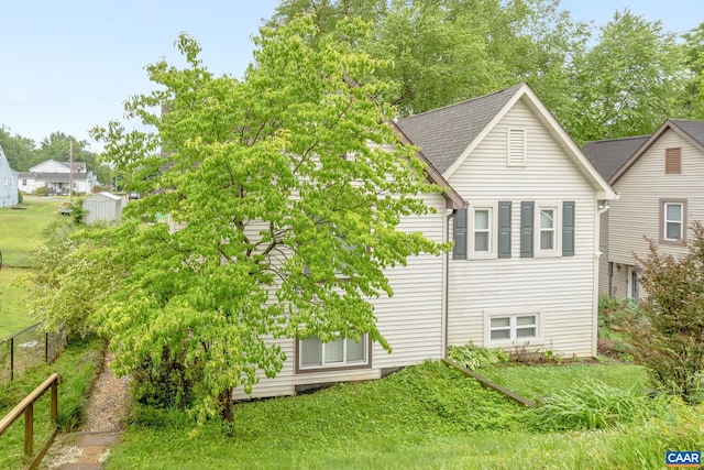 1216 Grove St, Charlottesville, VA 22903 - rear view of property with fence and a shingled roof