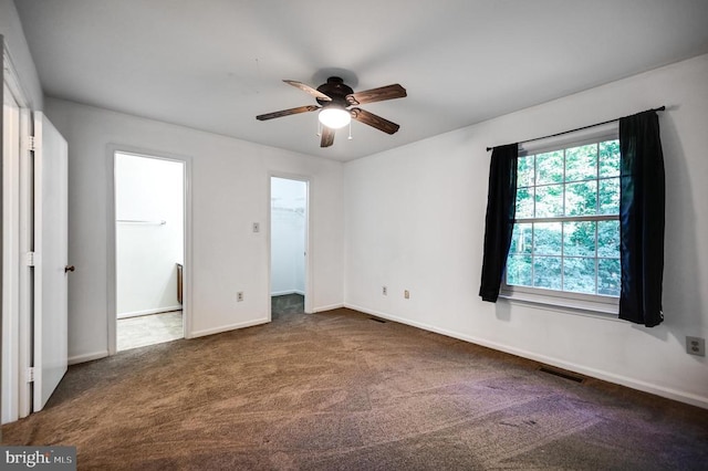 11175 Elwyn Ct, Fredericksburg, VA 22407 - unfurnished bedroom featuring carpet, a walk in closet, baseboards, and ceiling fan