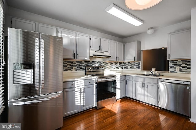 11175 Elwyn Ct, Fredericksburg, VA 22407 - kitchen with appliances with stainless steel finishes, under cabinet range hood, a sink, light countertops, and decorative backsplash