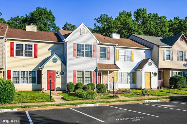 11175 Elwyn Ct, Fredericksburg, VA 22407 - view of property with a chimney and uncovered parking