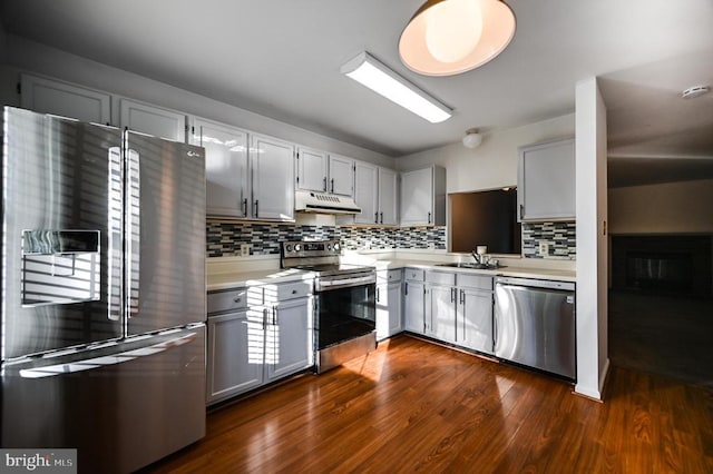 11175 Elwyn Ct, Fredericksburg, VA 22407 - kitchen with appliances with stainless steel finishes, under cabinet range hood, light countertops, decorative backsplash, and a sink