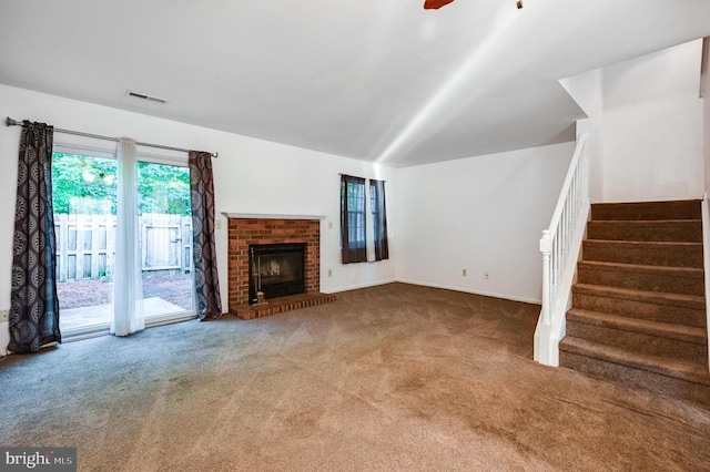 11175 Elwyn Ct, Fredericksburg, VA 22407 - unfurnished living room with carpet floors, stairway, a fireplace, and a ceiling fan