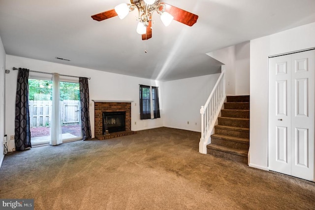 11175 Elwyn Ct, Fredericksburg, VA 22407 - unfurnished living room featuring carpet flooring, ceiling fan, stairs, and a brick fireplace