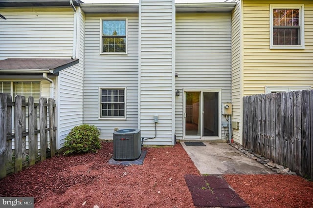11175 Elwyn Ct, Fredericksburg, VA 22407 - rear view of house with central air condition unit and a fenced backyard