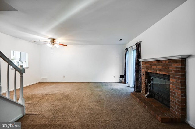 11175 Elwyn Ct, Fredericksburg, VA 22407 - unfurnished living room with a brick fireplace, carpet flooring, a ceiling fan, and stairway