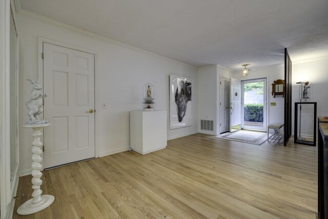 1217 Windsor Rd, Harrisonburg, VA 22801 - unfurnished room featuring baseboards, light wood-style floors, ornamental molding, and visible vents
