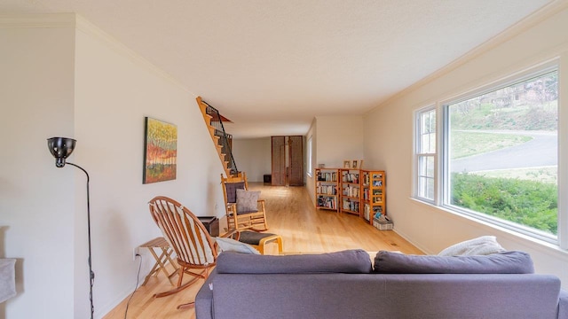 1217 Windsor Rd, Harrisonburg, VA 22801 - living area with stairway, ornamental molding, and light wood-style flooring