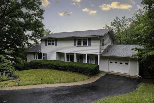 1217 Windsor Rd, Harrisonburg, VA 22801 - colonial-style house featuring an attached garage, a shingled roof, driveway, and a front lawn