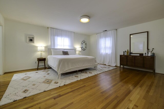 1217 Windsor Rd, Harrisonburg, VA 22801 - bedroom with baseboards, visible vents, and wood finished floors