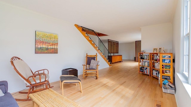 1217 Windsor Rd, Harrisonburg, VA 22801 - sitting room with crown molding, stairs, visible vents, and light wood-style floors