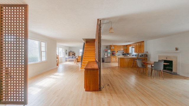 1217 Windsor Rd, Harrisonburg, VA 22801 - kitchen featuring a peninsula, light countertops, light wood-style flooring, and open floor plan