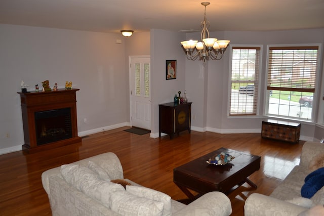 2894 Cullison Ct, Rockingham, VA 22801 - living room with a chandelier, wood finished floors, baseboards, and a fireplace