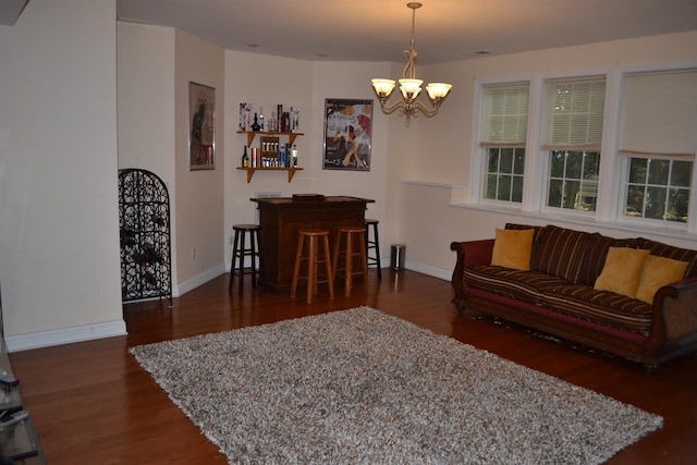 2894 Cullison Ct, Rockingham, VA 22801 - living room featuring wood finished floors, a chandelier, and baseboards