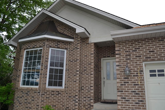 2894 Cullison Ct, Rockingham, VA 22801 - view of exterior entry with brick siding and a garage