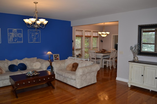 2894 Cullison Ct, Rockingham, VA 22801 - living area with a chandelier, wood finished floors, healthy amount of natural light, and baseboards