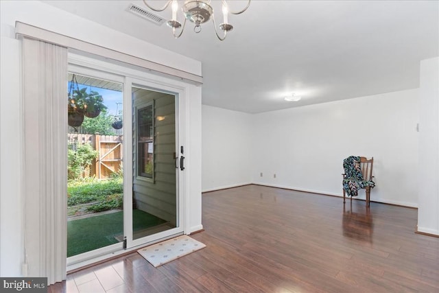 648 Ripplebrook Dr, Culpeper, VA 22701 - empty room featuring wood finished floors, a chandelier, and baseboards