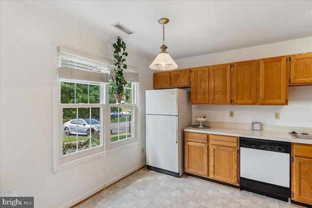 648 Ripplebrook Dr, Culpeper, VA 22701 - kitchen with white appliances, light countertops, hanging light fixtures, and brown cabinets