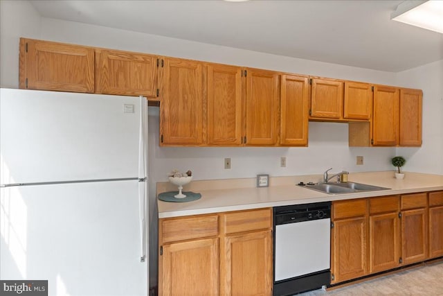 648 Ripplebrook Dr, Culpeper, VA 22701 - kitchen featuring white appliances, a sink, light countertops, and brown cabinets