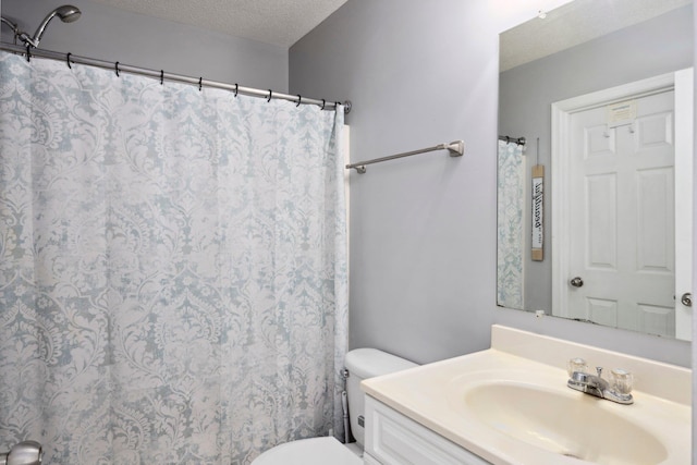 872 Camelot Ln, Harrisonburg, VA 22801 - full bathroom with a textured ceiling, toilet, and vanity