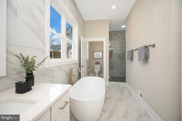 60 Laurelwood Dr, Mineral, VA 23117 - full bathroom featuring marble finish flooring, a stall shower, vanity, a freestanding bath, and recessed lighting
