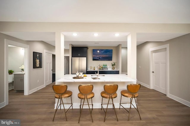 60 Laurelwood Dr, Mineral, VA 23117 - kitchen with a kitchen bar, stainless steel fridge, dark wood-style floors, recessed lighting, and dark cabinetry