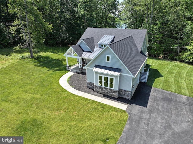 60 Laurelwood Dr, Mineral, VA 23117 - view of front facade featuring a standing seam roof, a metal roof, roof with shingles, stone siding, and a front yard