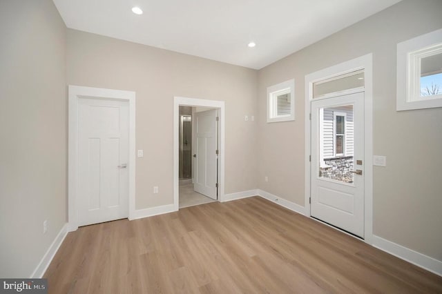 60 Laurelwood Dr, Mineral, VA 23117 - unfurnished bedroom featuring light wood-style flooring, multiple windows, recessed lighting, and ensuite bath