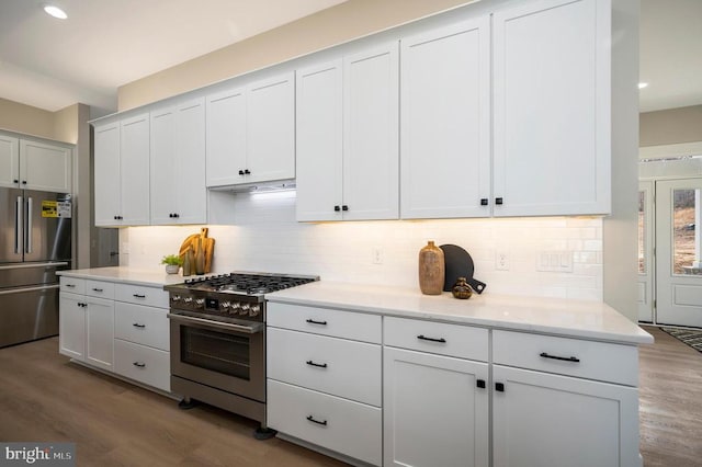 60 Laurelwood Dr, Mineral, VA 23117 - kitchen with appliances with stainless steel finishes, wood finished floors, tasteful backsplash, white cabinets, and recessed lighting