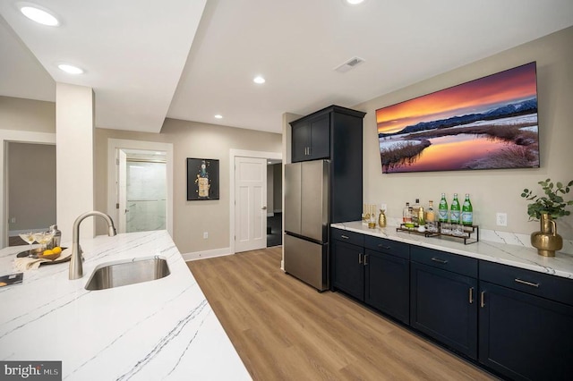 60 Laurelwood Dr, Mineral, VA 23117 - indoor dry bar featuring freestanding refrigerator, light wood-style floors, and recessed lighting