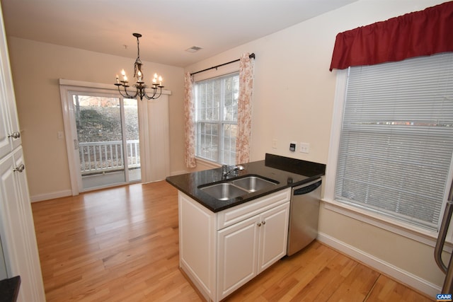 kitchen with dishwasher, an inviting chandelier, a sink, white cabinetry, and light wood-style floors