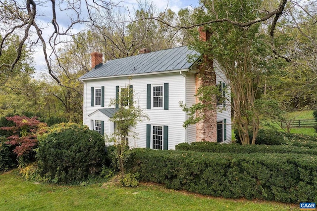 19184 Mt Sharon Rd, Orange, VA 22960 - view of side of property featuring a chimney, metal roof, and a standing seam roof