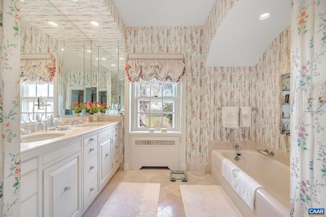 19184 Mt Sharon Rd, Orange, VA 22960 - full bathroom featuring a sink, radiator, double vanity, a garden tub, and wallpapered walls