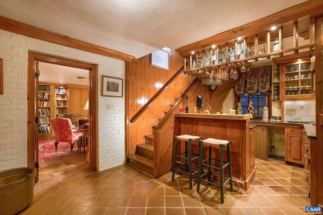 19184 Mt Sharon Rd, Orange, VA 22960 - bar featuring indoor bar, stairway, wood walls, and brick wall